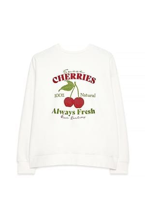 Vit sweatshirt med grafiskt körsbärstryck och texten Sweet Cherries.
